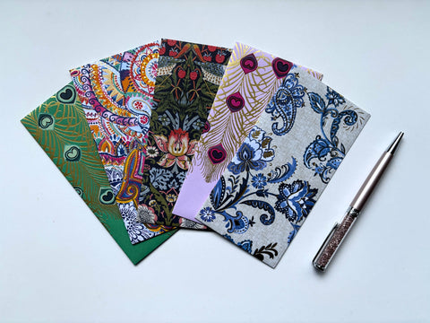 Intricate flora and fauna with gold specks money envelopes for CNY, Eid and Christmas