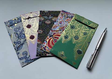 Intricate flora and fauna with gold specks money envelopes for CNY, Eid and Christmas