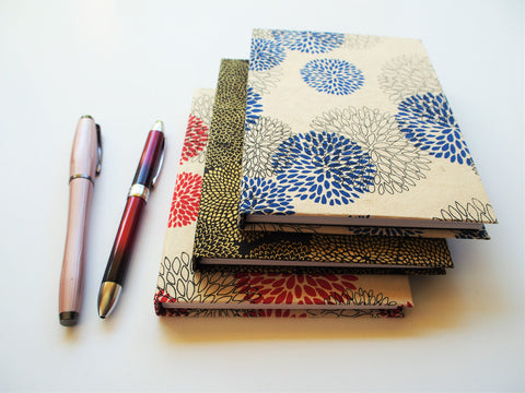 Handbound A6 journals with floral Lokta covers in red, blue or gold | handmade books for sketching, writing, doodling, note-taking