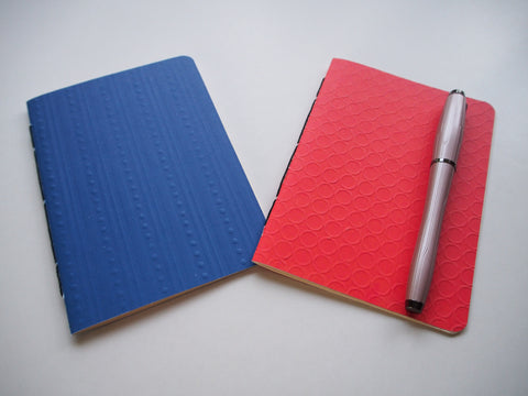 Blue and orange embossed hand-bound notebooks--set of 2