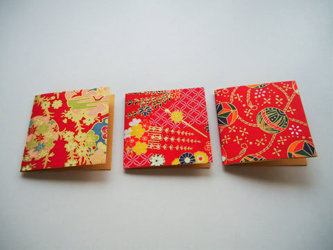Origami paper gift tags on orange cardstock
