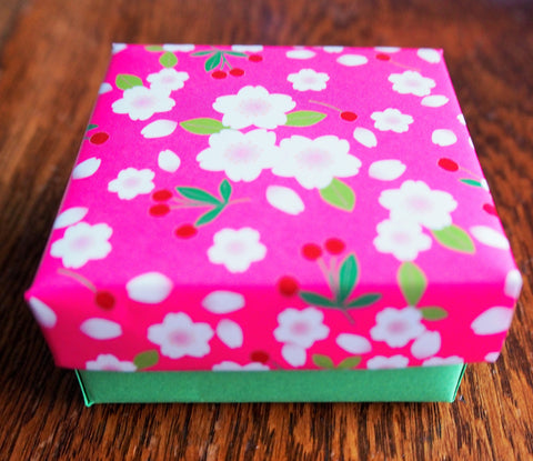 Pink and green cherry blossom origami gift box with lid
