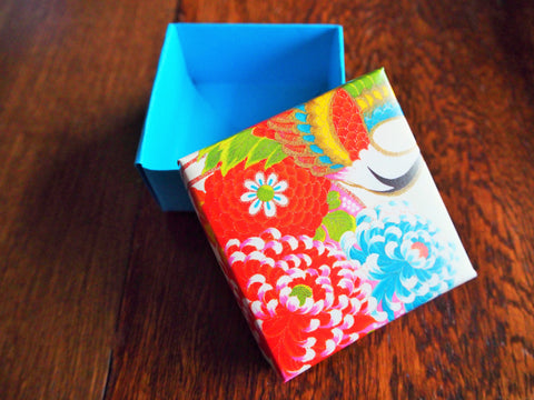 Red and blue floral gift box with lid