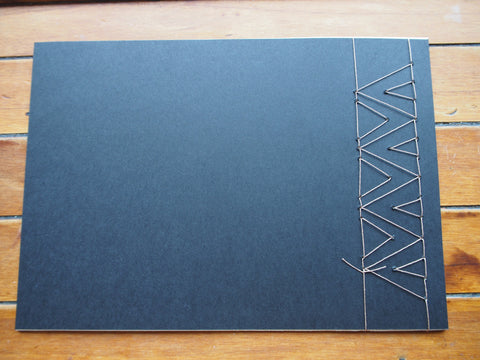 Japanese stab binding notebooks with unique hand-bound decorative designs: Arrows, Hearts, Chevron
