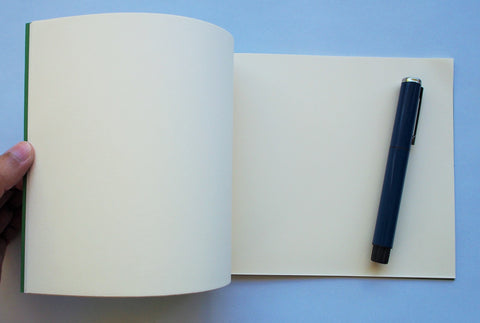 Festive special: notebooks with unique hand-bound decorative designs in forest green with maple leaves binding