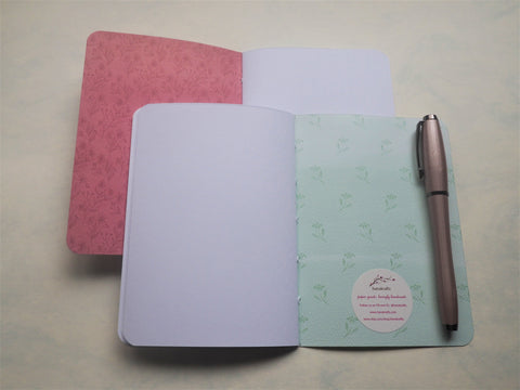 Elegant purple and pink florals on white--set of 2 handbound notebooks for Christmas
