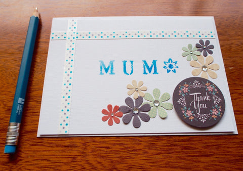 White and blue 'Thank You' stenciled Mother's Day card with flowers and pearls